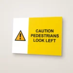 Caution Pedestrians Look Left Sign