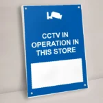 CCTV in Operation in This Store Write-On Sign: CCTV in Operation in This Store Write On Sign shown on a wall with stand off fixings