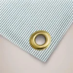 Pedestrians Must Use This Route Site Banner: Close up of a brass eyelet in a mesh site banner