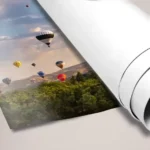 10ft x 3ft PVC Banner: Printed banner partly rolled up, showing the print quality
