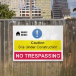 Lamp Post Toblerone Signs: Printed Correx site safety sign on a timber hoarding