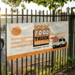 Business Banners: Printed food truck festival banner on black railings